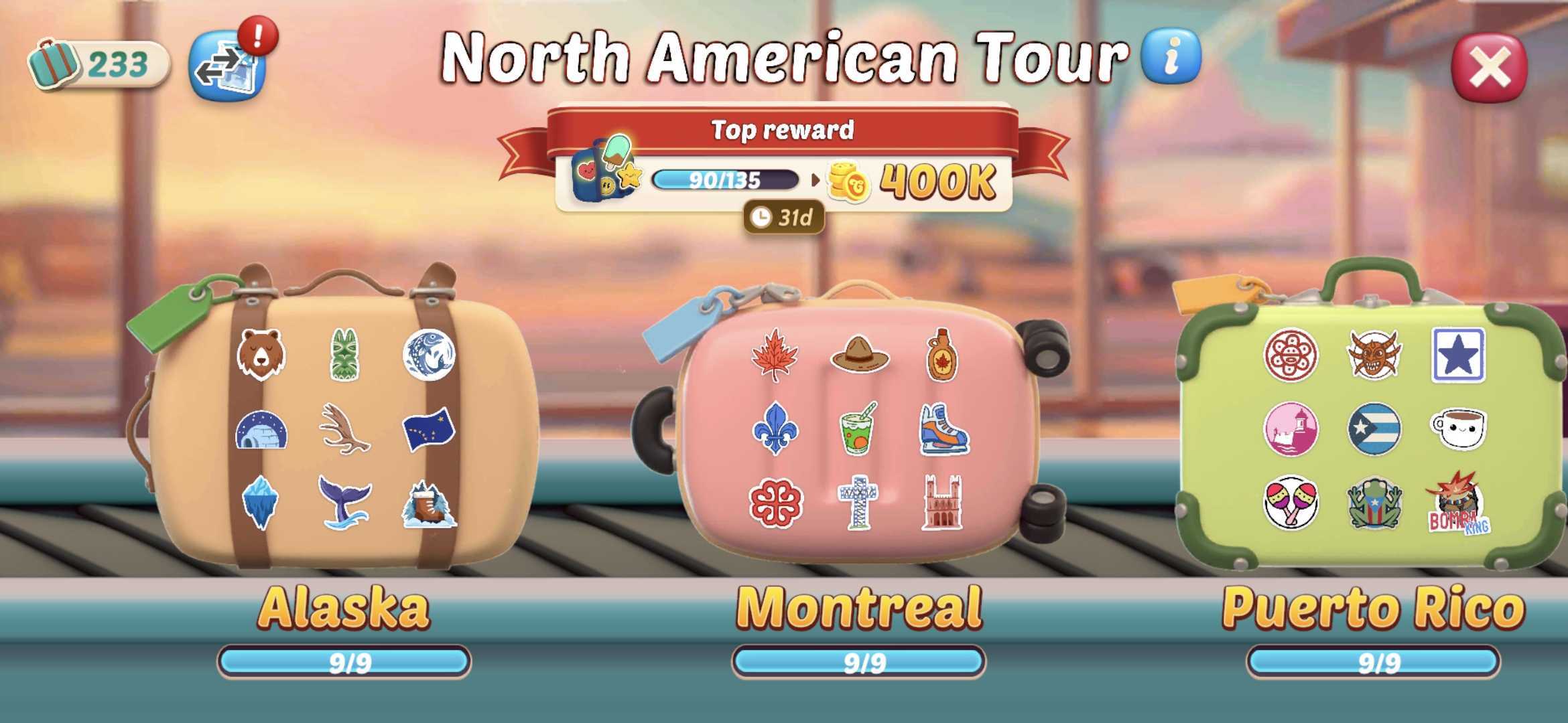 Candy Crush Solitaire screen titled “North American Tour” showing a top reward of 400 K coins with progress 90/135. Below are three suitcases labeled Alaska, Montreal, and Puerto Rico—each at 9/9 completion and decorated with destination-themed stickers